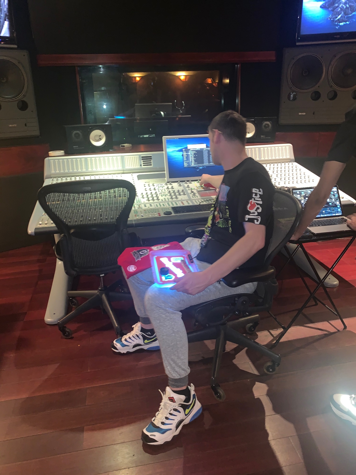 Recording session at a large-format SSL mixing console with mastering monitors